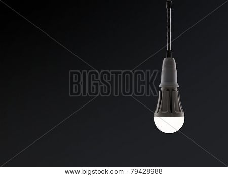Energy saving LED light bulb isolated on a black bakground