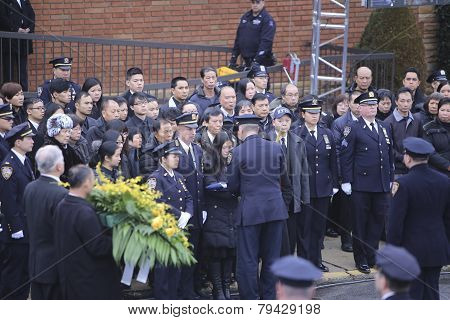 Widow receiving flag from officer
