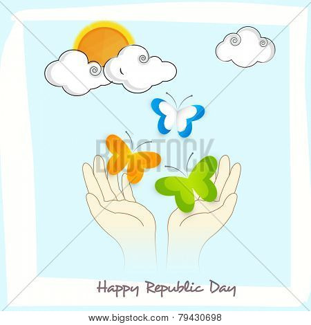 Human hands releasing butterflies in national flag colors on skyblue background for Happy Indian Republic Day celebration.