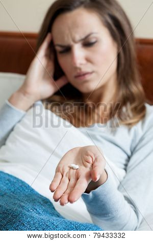 Woman Suffering From Migraine
