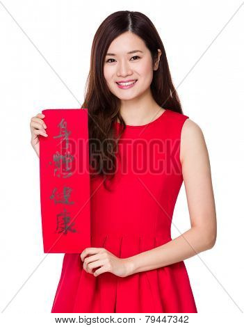 Woman hold with china fai chun, phrase meaning is blessing for good health 