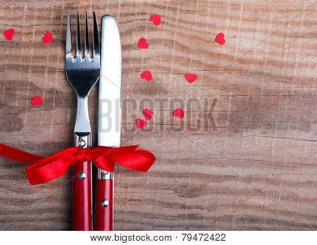 Knife And Fok And Little Red Hearts On The Wooden Table.