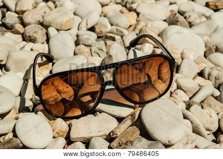 Sun Glasses On A Seashore