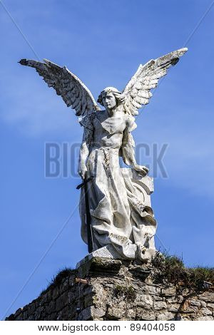 Sculpture Of A Guardian Angel With A Sword In The Cemetery Of Comillas