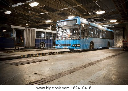 Dirty, Oily Bus Garage Inspection Pit