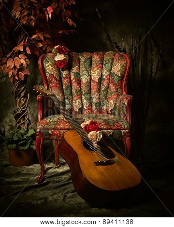Vintage Acoustic Guitar Leaning Against Antique Chair