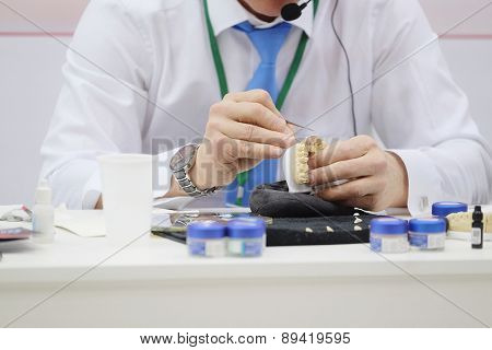 Dental technician working the partial denture 