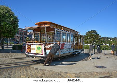 Passengers enjoy a ride in a cable car
