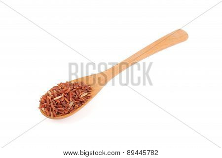 Red Rice In A Wooden Spoo