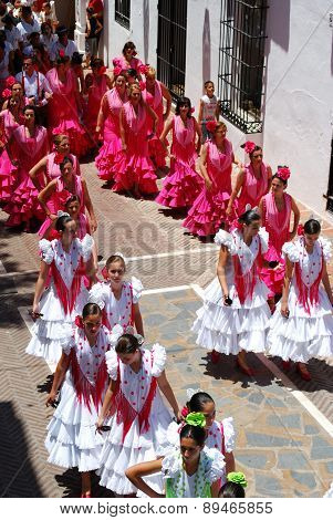 Teenage flamenco dancers in the street.