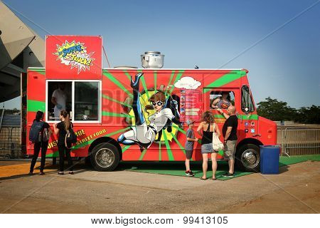 MONTREAL, CANADA - JULY 3, 2015: People waiting for their lunch at food trucks into the business area in Montreal, Quebec on july 23.
