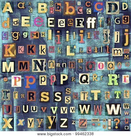 Colorful grunge newspaper, magazine collage letters background