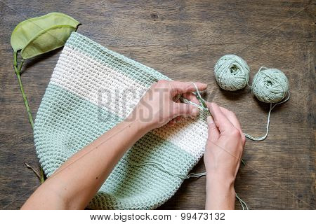 Hand Knitting Crochet Bag On A Wooden Table