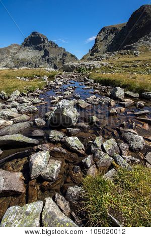 Mountain river and Orlovets peak, Rila Mountain