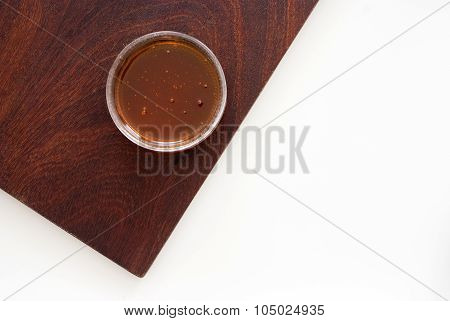 Golden Honey In A Glass From Above - Studio Shot