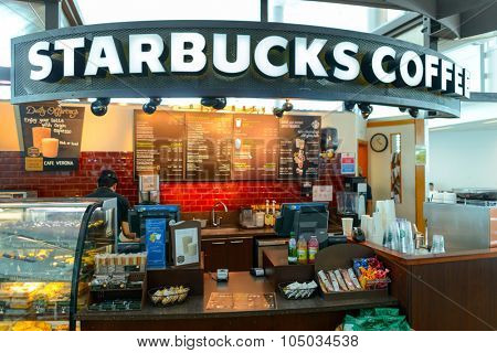 DUBAI - APRIL 18, 2014: Starbucks cafe. Starbucks locations serve hot and cold beverages, whole-bean coffee, microground instant coffee, espresso, caffe latte, full-leaf teas, pastries, and snacks