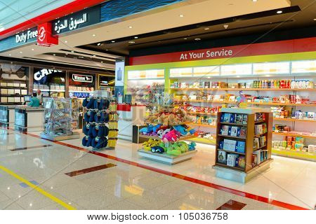 DUBAI, UAE - APRIL 18, 2014: the interior of Concourse A. The concourse includes one 4 star hotel and one 5 star hotel, first and business class lounges, and duty-free areas