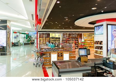 DUBAI, UAE - APRIL 18, 2014: the interior of Concourse A. The concourse includes one 4 star hotel and one 5 star hotel, first and business class lounges, and duty-free areas