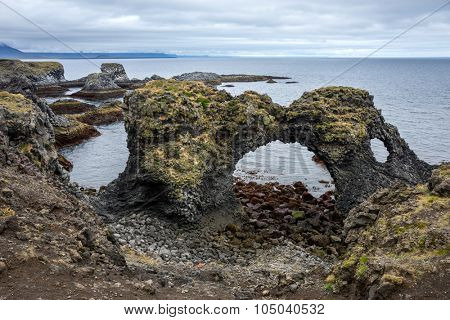 Volcanic laval rock formations along the coast line of Iceland