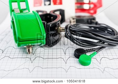 ECG electrodes  on the background of the electrocardiogram