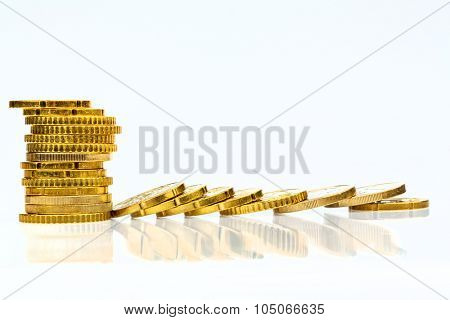 stacked and lying coins symbolfoto for debt, profit collapse and deductions