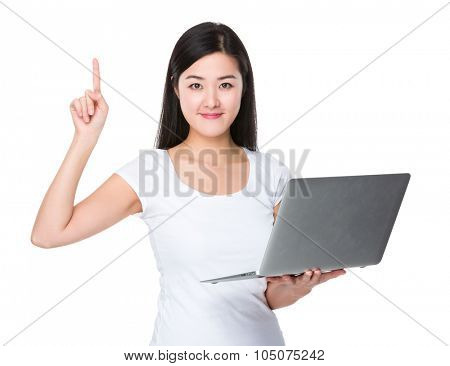 Asian woman use of the noteboook computer and finger point up