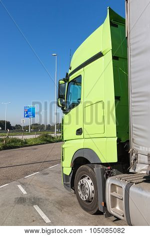 Green Truck Is Standing On The Car Park