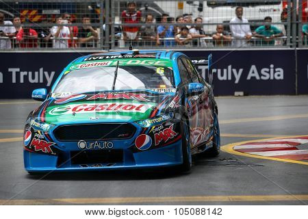 KUALA LUMPUR, MALAYSIA - AUGUST 08, 2015: Chaz Mostert from the Pepsi Max Crew team races in the V8 Supercars Street Challenge at the 2015 Kuala Lumpur City Grand Prix.