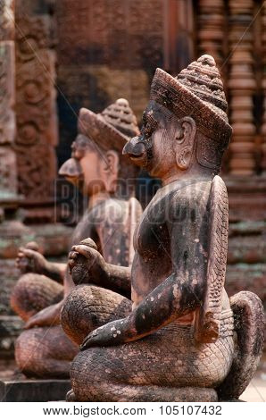 Stone sculputure sitting in front of temple B