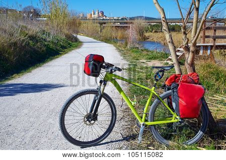 cycling tourism MTB bike in Ribarroja Parc de Turia with paniers and saddlebag