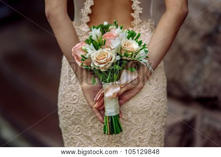 Bride with bouquet in hand