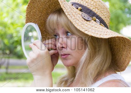 European Blond Woman In Straw Hat
