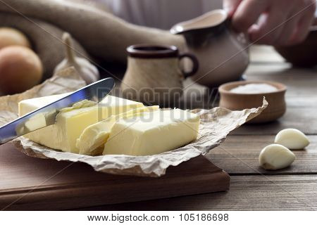 Butter With A Knife And A Cup With Milk