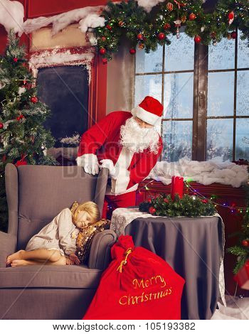 Littlle Sleeping Girl And Santa Claus Looking At Her