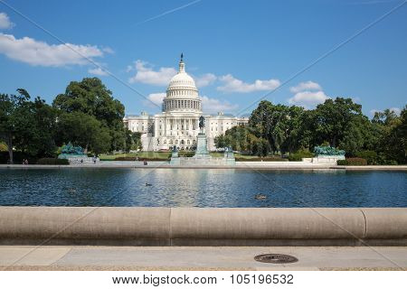 USA, WASHINGTON - AUG 26, 2014: Ulysses S. Grant Memorial near Capitol Reflecting Pool and United States Capitol at summer sunny day.