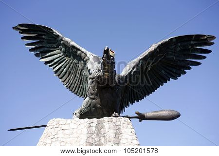 Statue Of The Famous Hungarian Legendary Turul Bird Against Blue Sky