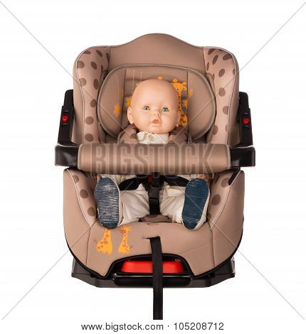 Baby doll in a booster seat for a car