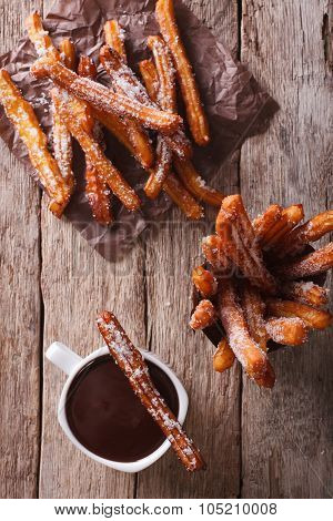 Churros And Hot Chocolate Close-up. Vertical Top View