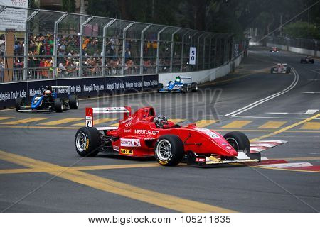 KUALA LUMPUR, MALAYSIA - AUGUST 09, 2015: Single seater racing cars race in the city street circuit in the Formula Masters China Series Race at the 2015 Kuala Lumpur City Grand Prix.