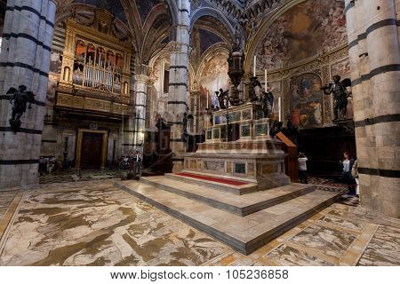 SIENA, ITALY - October 10, 2015: Interior of Siena Cathedral, Italian Duomo di Siena, Santa Maria Assunta. The 13th century church with its mosaic floor is a major tourism attraction in Siena, Italy 