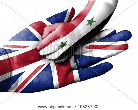 Adult Man Holding A Baby Hand With United Kingdom And Syria Flags Overlaid. Isolated On White