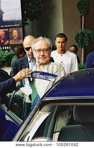 CANNES, FRANCE - MAY 15: French director Jean-Luc Godard pose at the Palais des Festivals during the photocall of 'L'Eloge de l'Amour' May 15, 2001 in Cannes, France