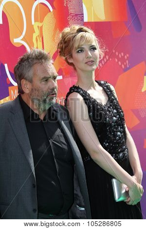 MOSCOW - JUNE 26: Louise Bourgoin and Luc Besson attend the closing ceremony of 32nd Moscow Film Festival on June 26, 2010 in Moscow, Russia