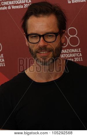 VENICE, ITALY - SEPTEMBER 02: Actor Guy Pearce poses at the 'Mildred Pierce' photocall at the Palazzo del Cinema during the 68th Venice Film Festival on September 2, 2011 in Venice, Italy.
