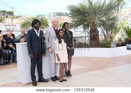 esuthesan Antonythasan, director Jacques Audiard, Claudine Vinasitamby and Kalieaswari Srinivasan attends a photocall for 'Dheepan' during the 68th Cannes Festival on May 21, 2015 in Cannes, France.