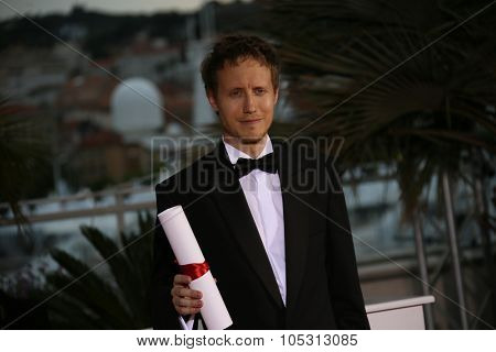 Laszlo Nemes attends a photocall for the winners of the Palm D'Or during the 68th annual Cannes Film Festival on May 24, 2015 in Cannes, France.