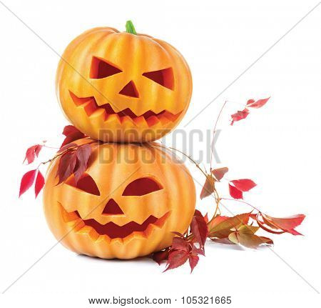 Halloween pumpkin head jack lantern with burning candles isolated on white background. Halloween holidays art design, celebration. Two Carved Halloween Pumpkins