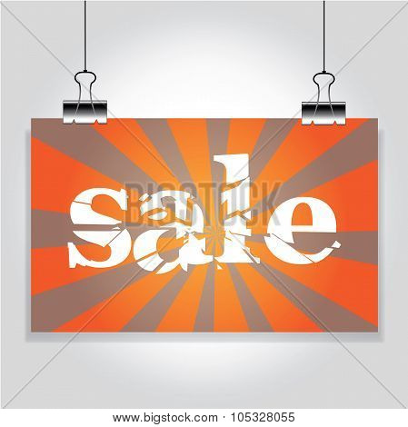 Sale Sign Hanging On The Clamps