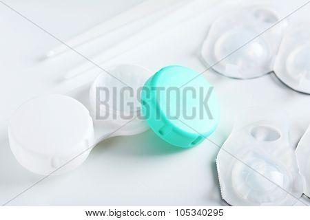 Contact Lenses In Container With Solution On White Background