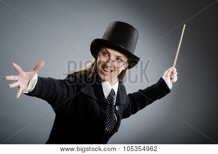  Potter girl with magic stick against gray